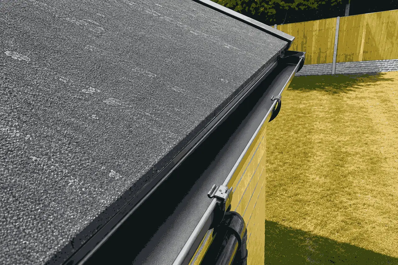 After gutter cleaning using ground-based vacuum system showing completely clear gutter channel