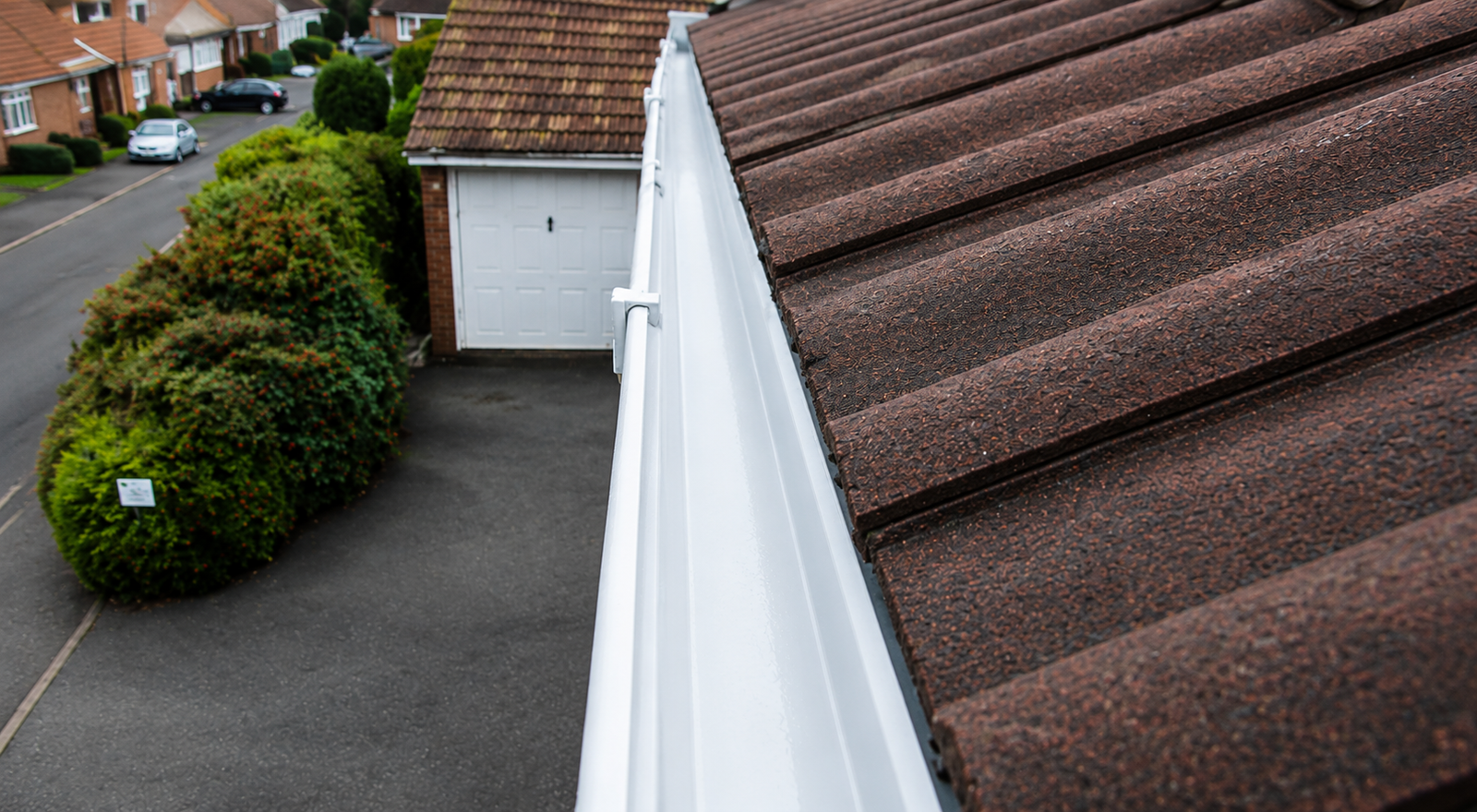 Birmingham gutter after professional cleaning showing clear channel with roofline protection fully restored