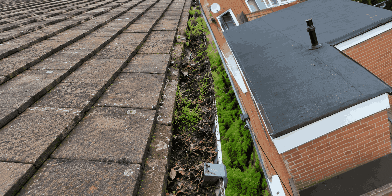 Gutter overflowing severely after heavy rain on Birmingham property