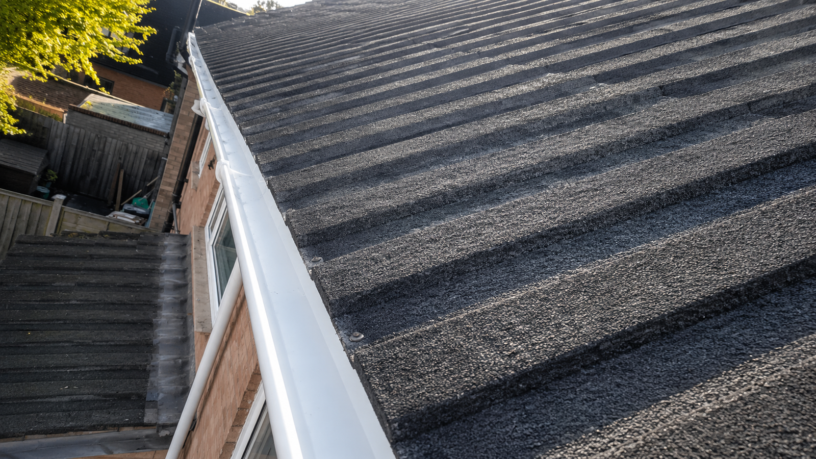 Birmingham gutter after professional cleaning showing clear channels and proper water flow