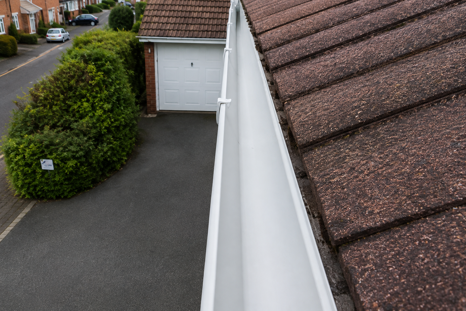 After professional gutter cleaning — channel fully cleared and flowing freely