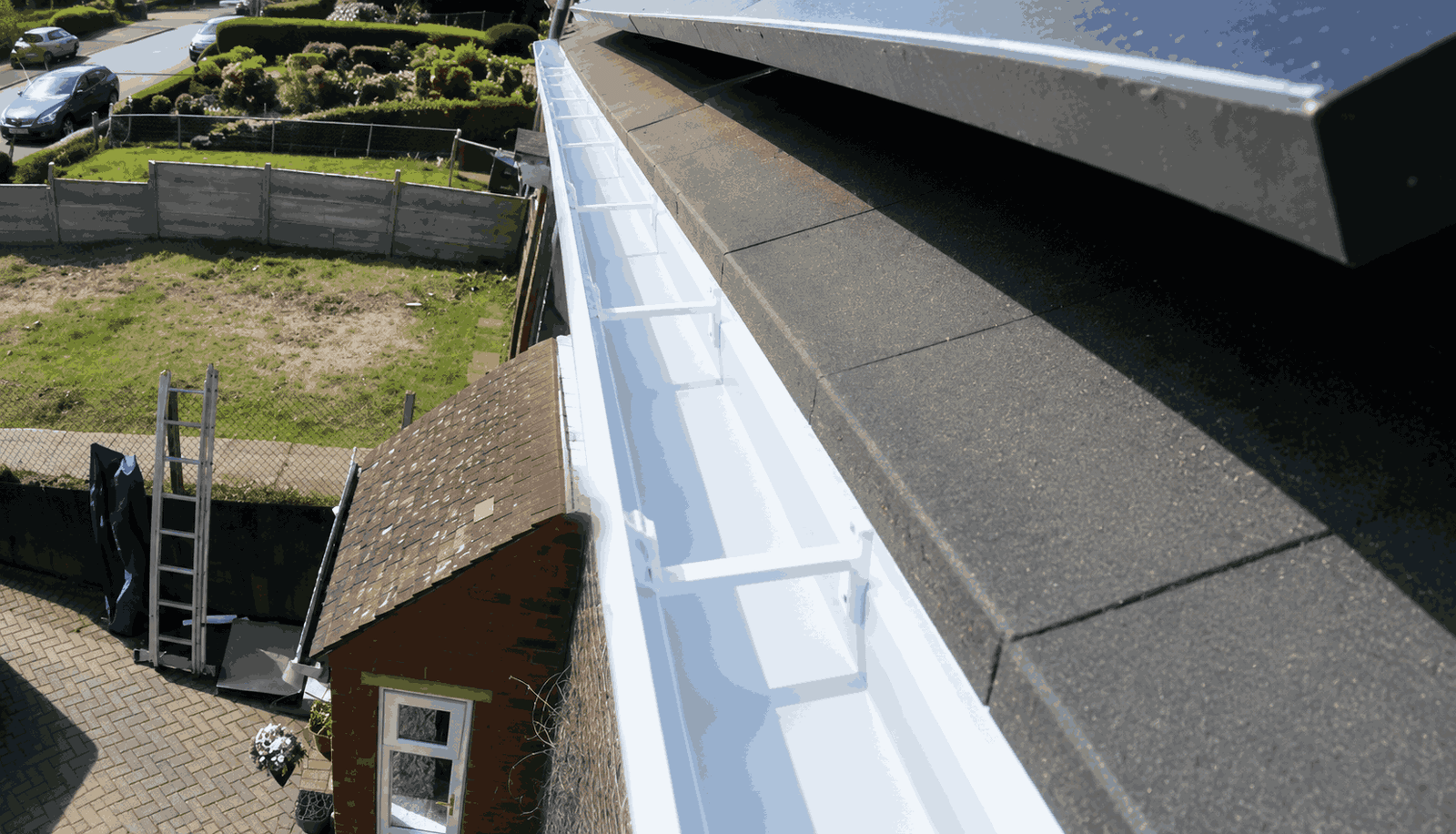 Clean, empty gutter channel floor after high-reach vacuum clearing ready for property marketing