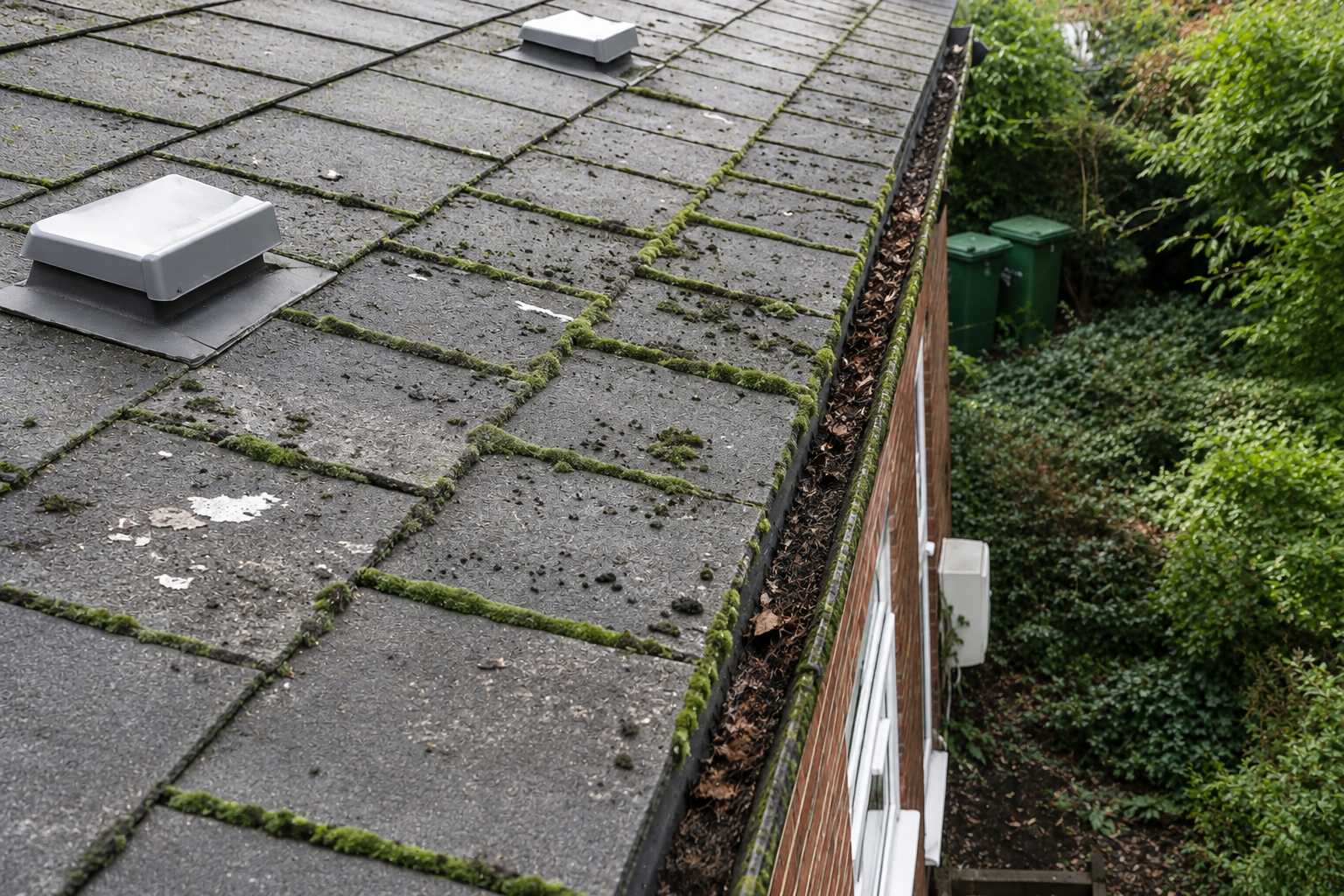 Before gutter inspection Birmingham showing compacted debris in channel