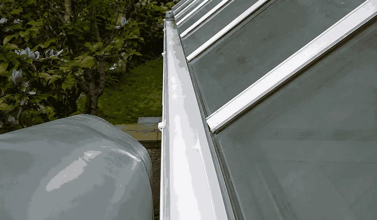 After gutter cleaning — same gutters fully cleared to the channel with downpipes running freely