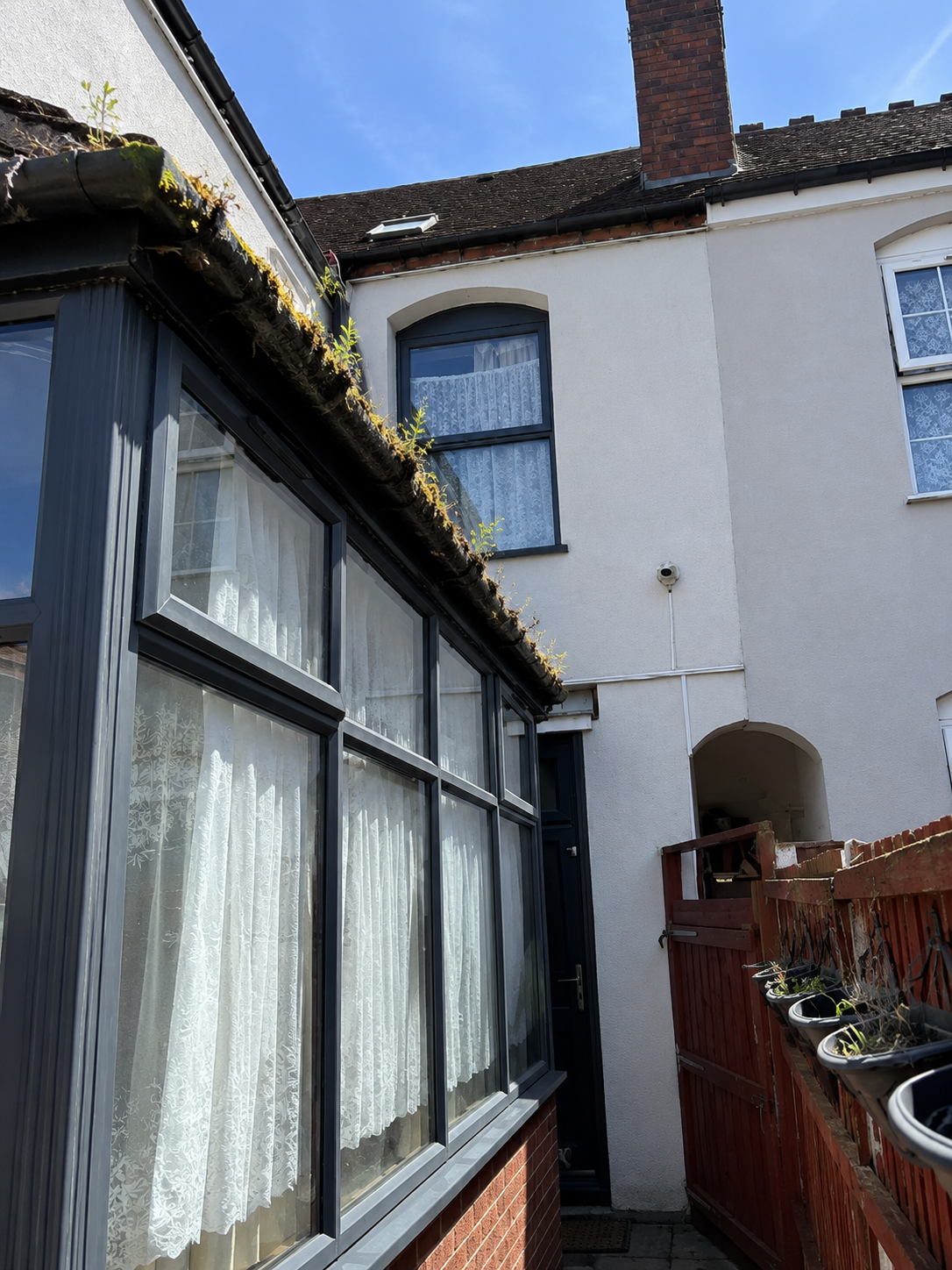 Before gutter cleaning Acocks Green B27 — debris and leaf compaction in blocked gutter channel