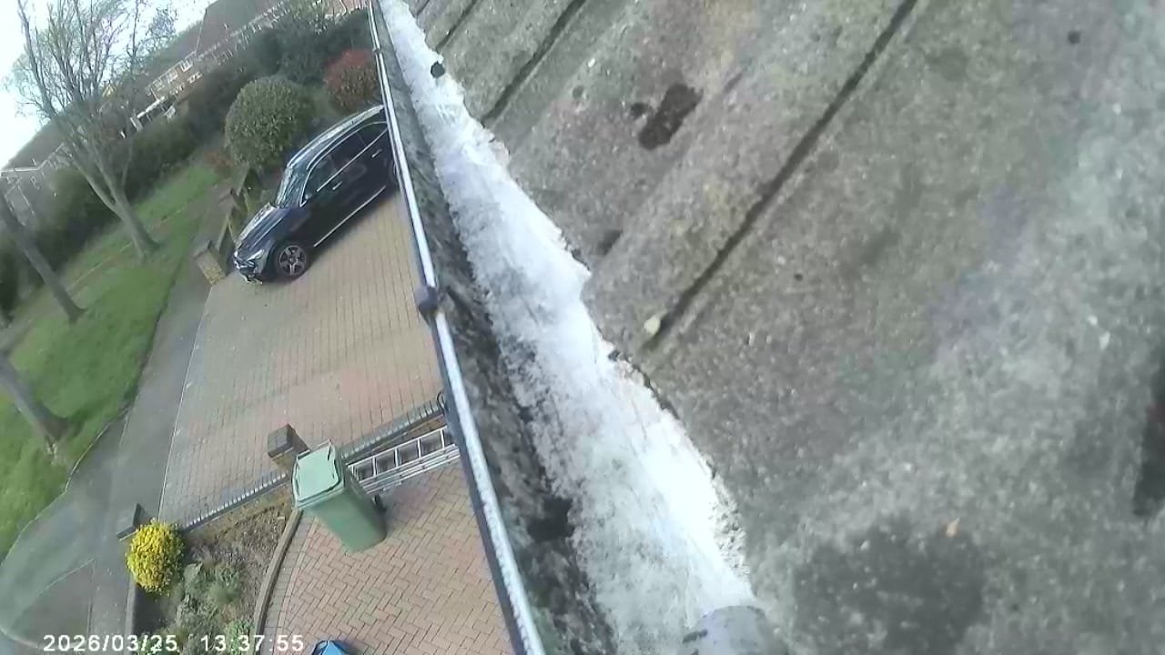 After professional gutter cleaning - clean gutter channel flowing freely