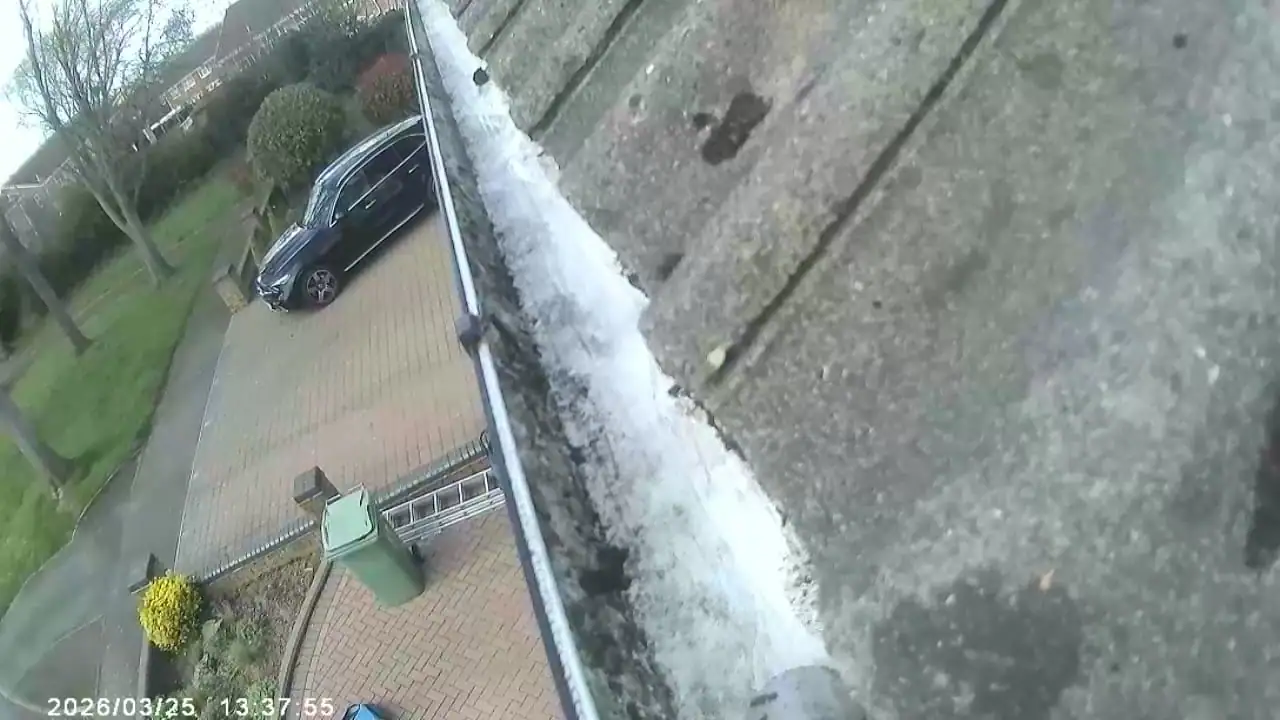 After professional gutter cleaning - clean gutter channel flowing freely