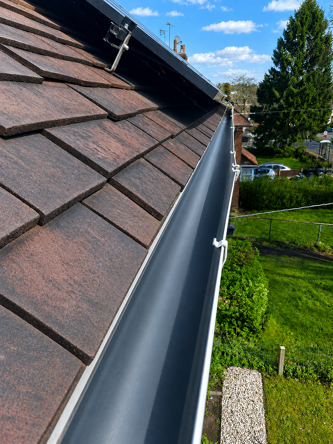 After gutter cleaning in Walsall — gutter fully cleared to the plastic channel by WOW Gutters, flowing freely