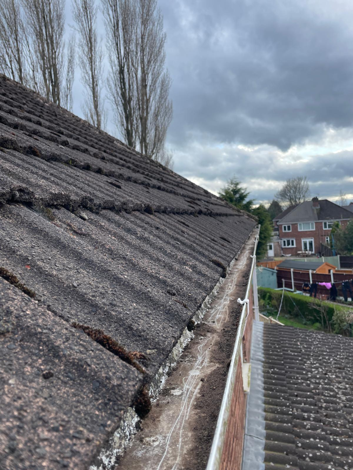 After gutter cleaning and fascia washing in the West Midlands — gutters fully cleared, fascias and soffits restored to bright white finish