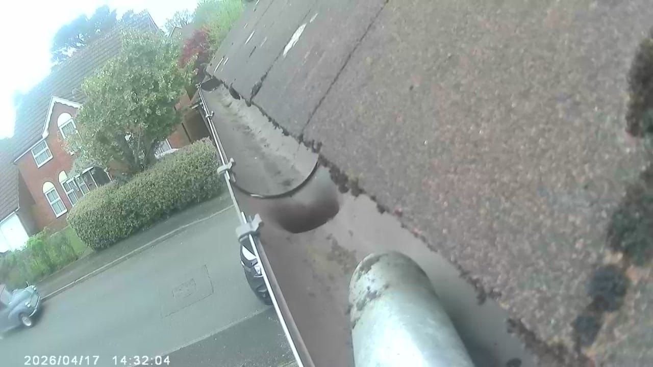 After gutter cleaning in Wolverhampton — gutter fully cleared down to the plastic channel, downpipe flowing freely